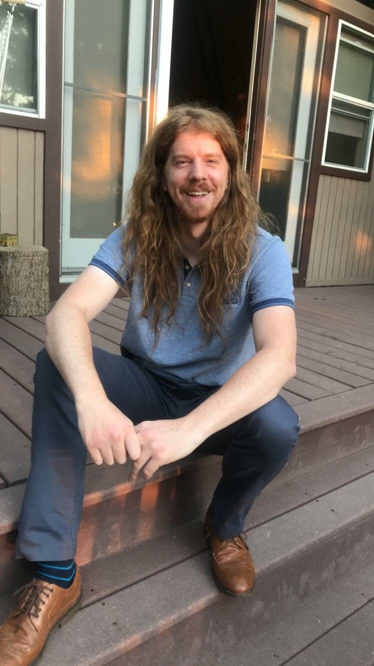 Man sits on wooden steps